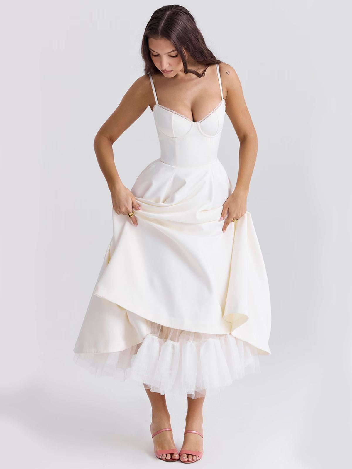 Eclipse Corset Gown – A classic white midi dress featuring a fitted corset top, soft satin fabric, and elegant tulle underlay.