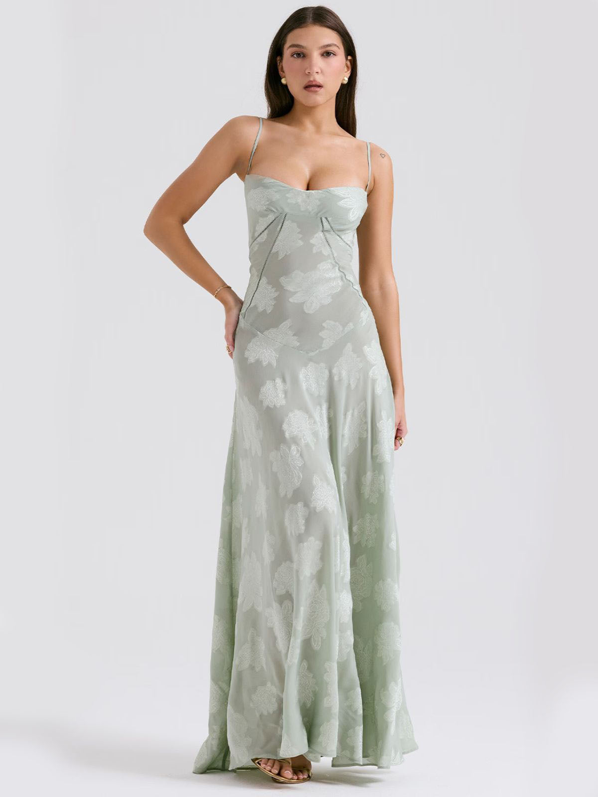 Green floral maxi dress with a soft sage tone, showcasing a flattering silhouette and floral lace embroidery.