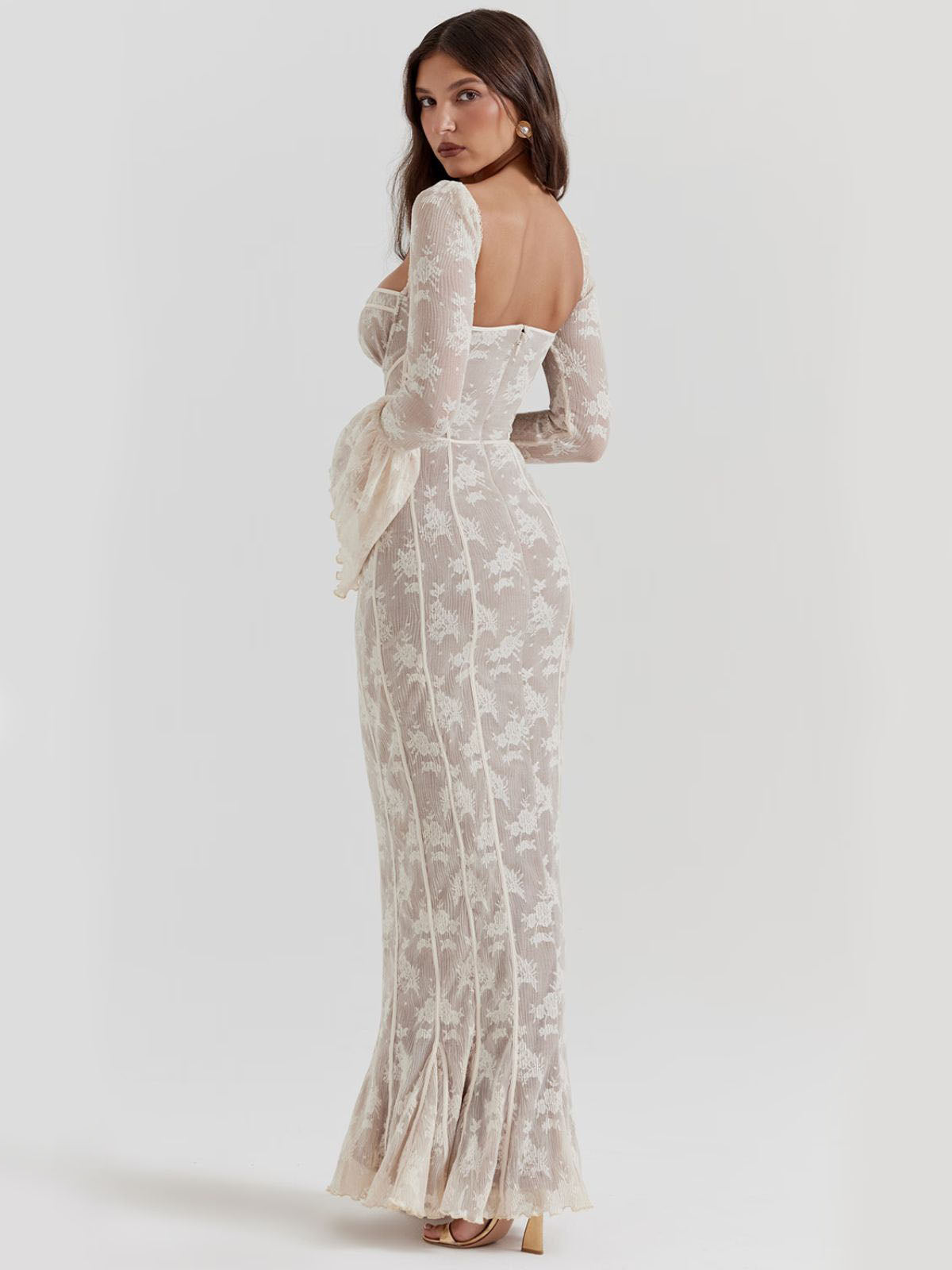 Arabella Long Sleeve Lace Maxi Dress - White, back view with sheer lace fabric, elegant mermaid silhouette, and corset-style fit.