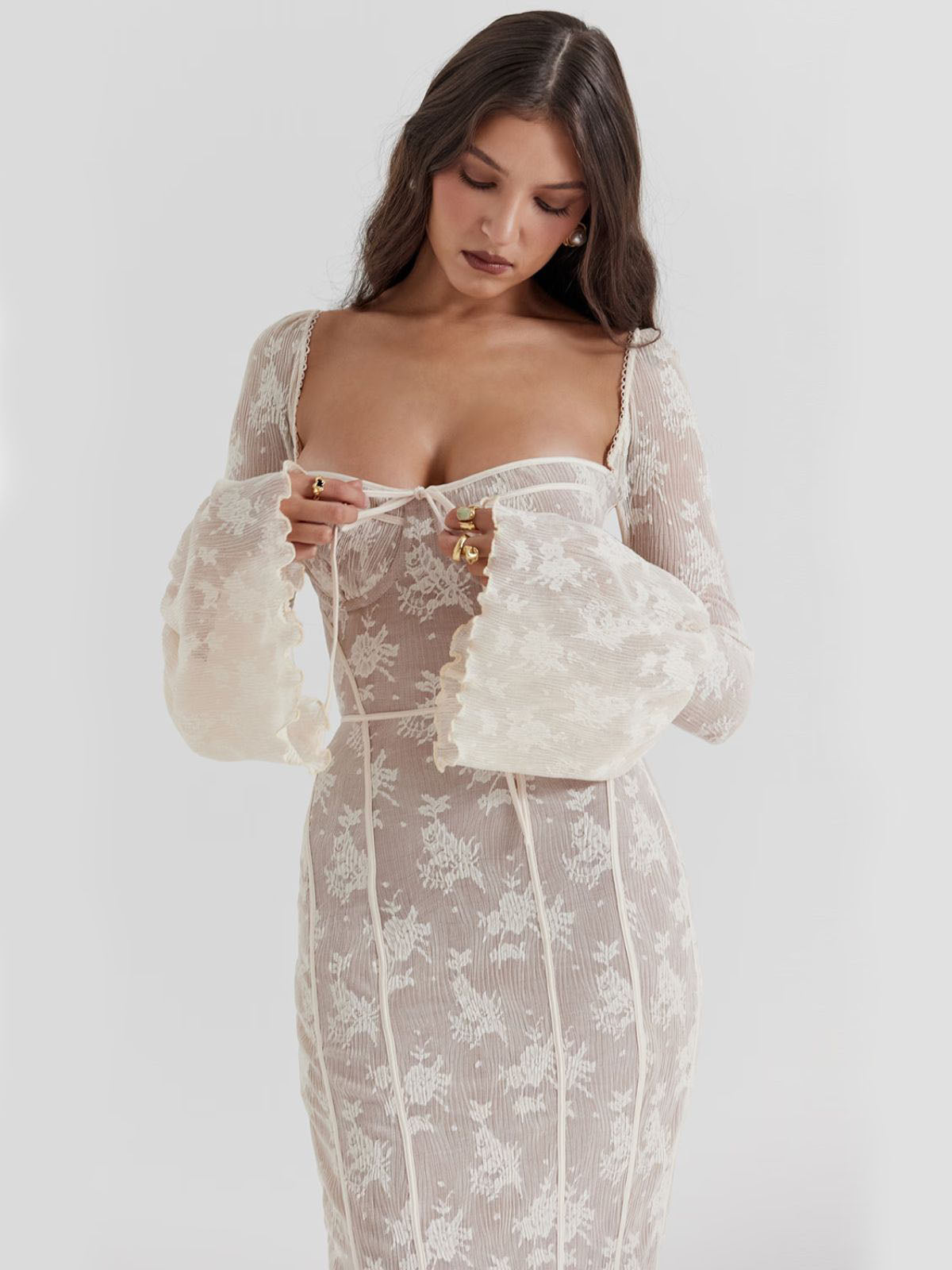 Arabella Long Sleeve Lace Maxi Dress - White, close-up shot showing intricate lace details, soft sheer fabric, and bow-tie front.