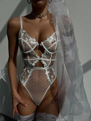 Allure Sheer Bodysuit - White close-up view highlighting delicate embroidery, polka-dot accents, and an exquisite design.