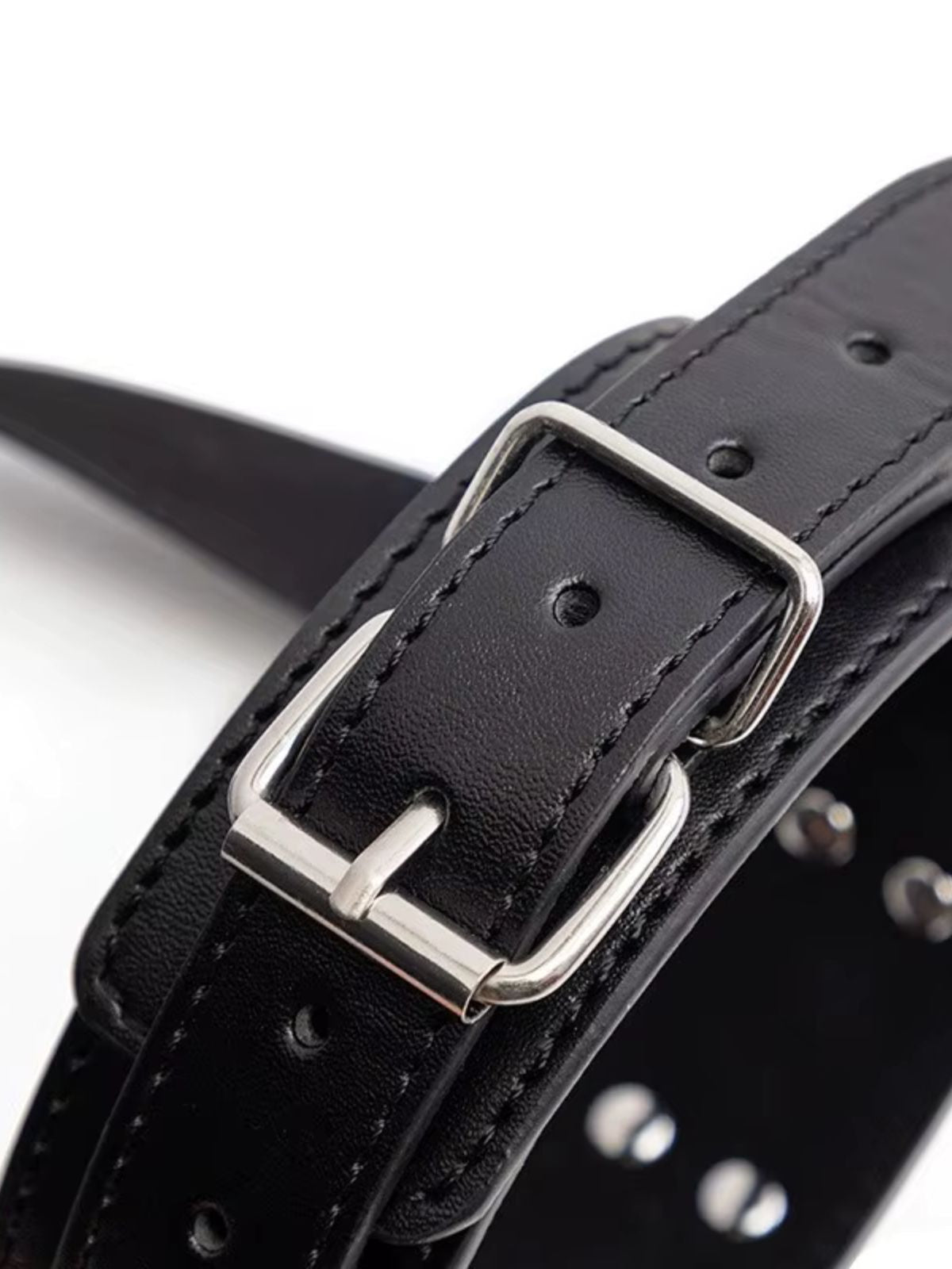 bdsm restraints adjustable buckle detail with black strap and silver metal hardware