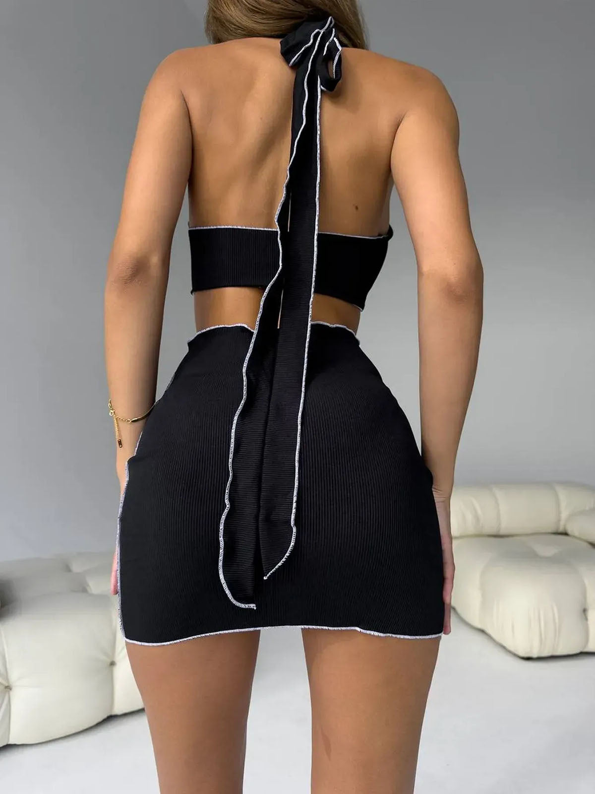 Bikini Skirt Set Black back view showing fitted mini skirt cover-up and halter tie detail