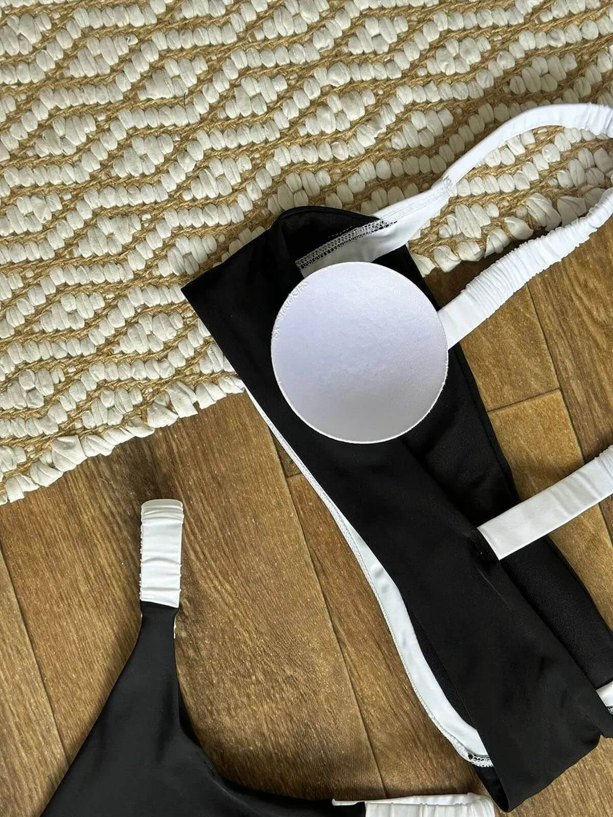 black bikini with white trim top detail with removable padding and white shoulder straps