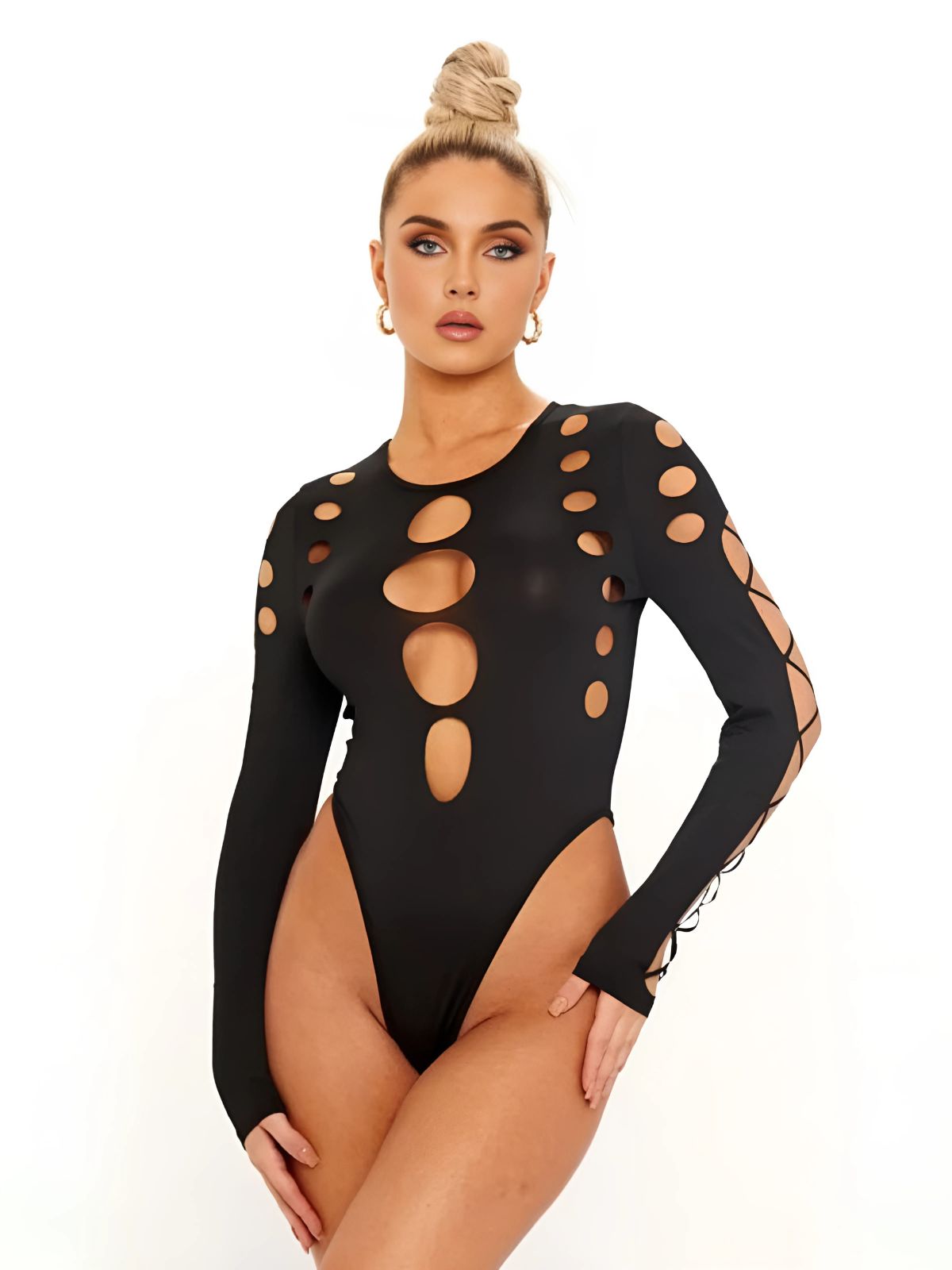 Black cut out bodysuit styled with long sleeves, model posing to highlight modern fashion trends.