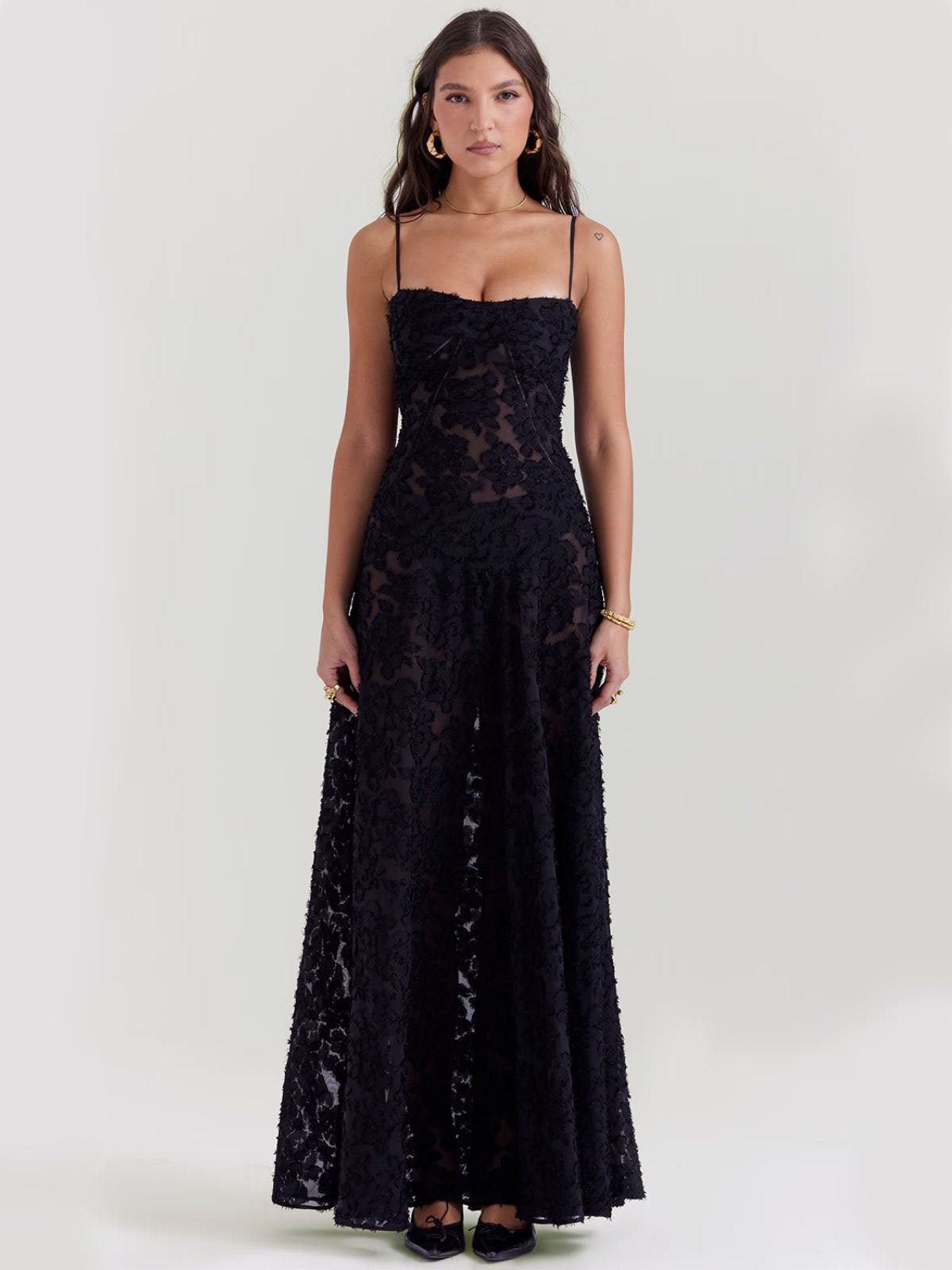 Black floral maxi dress featuring a fitted bodice, sweetheart neckline, and elegant floral lace overlay for a timeless look.
