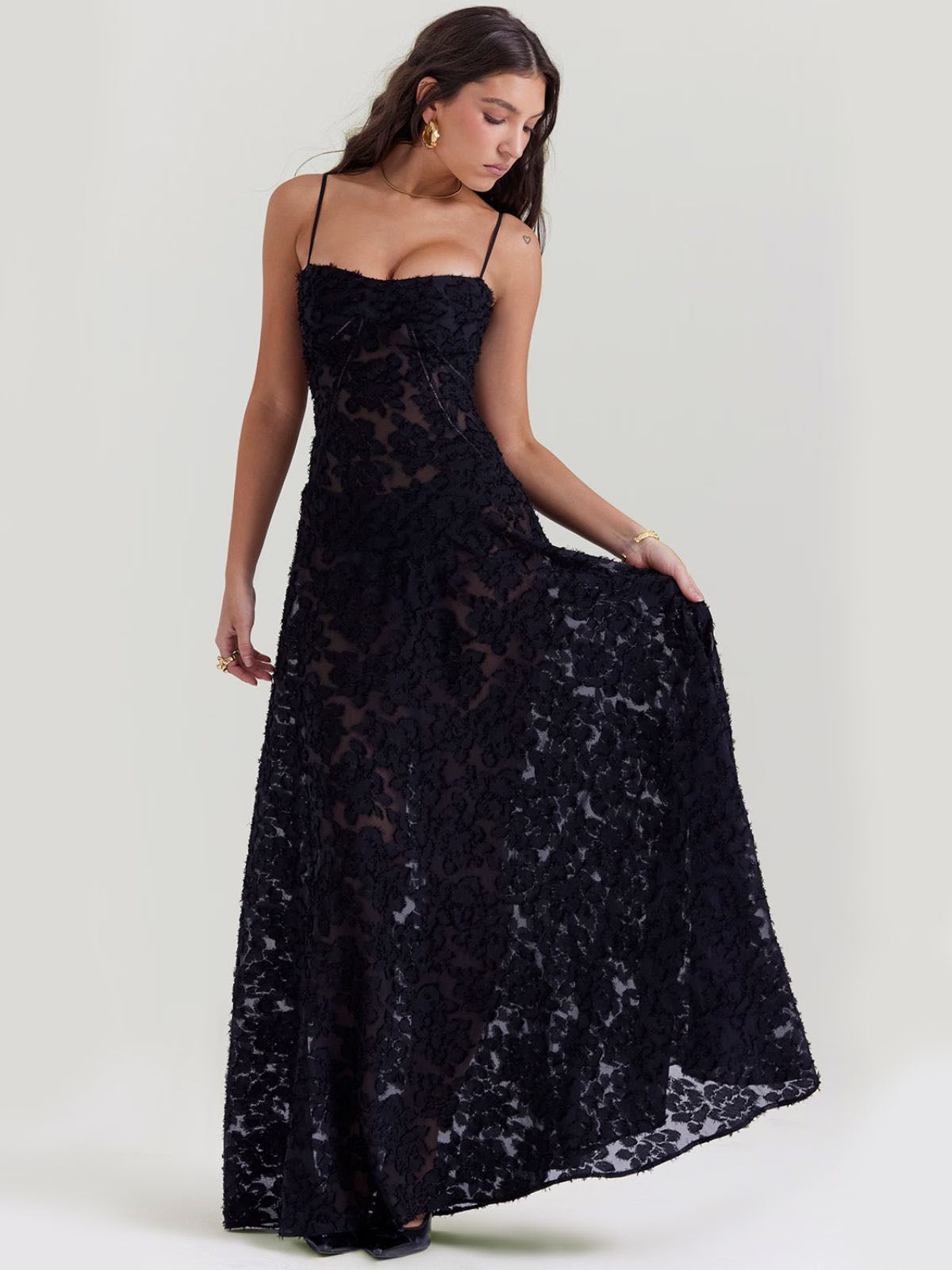 Black floral maxi dress with delicate lace details and a sheer flowy skirt, perfect for formal events or glamorous nights.