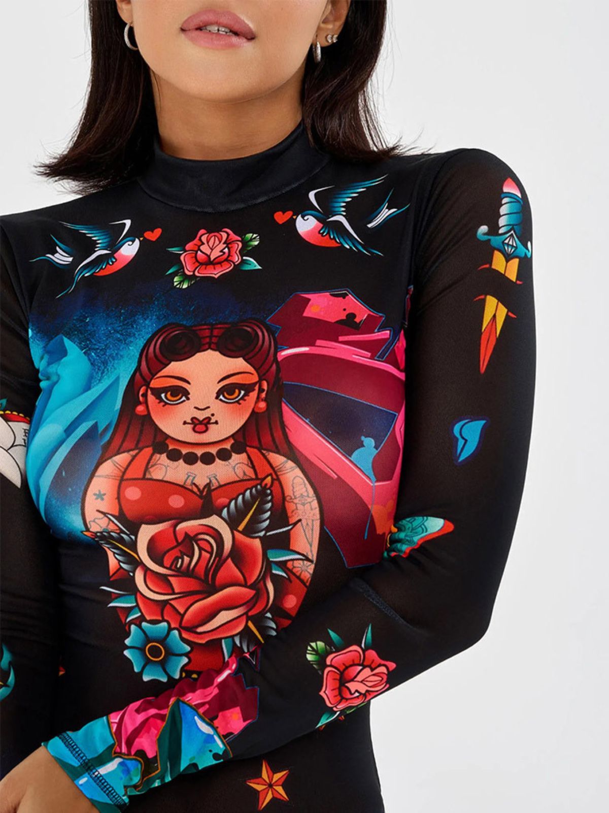 Close-up of vibrant artistic print on black mesh bodysuit, showcasing unique street fashion style.