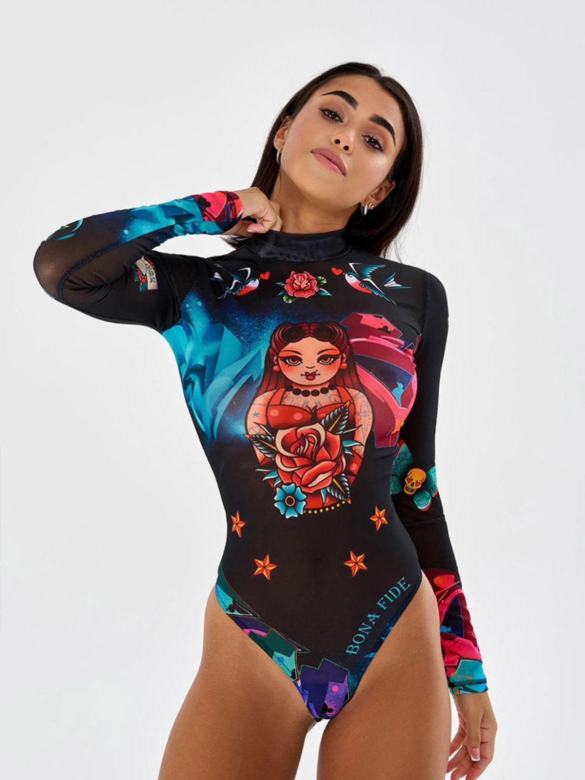Detailed view of artistic print on black mesh bodysuit, ideal for unique and stylish looks.