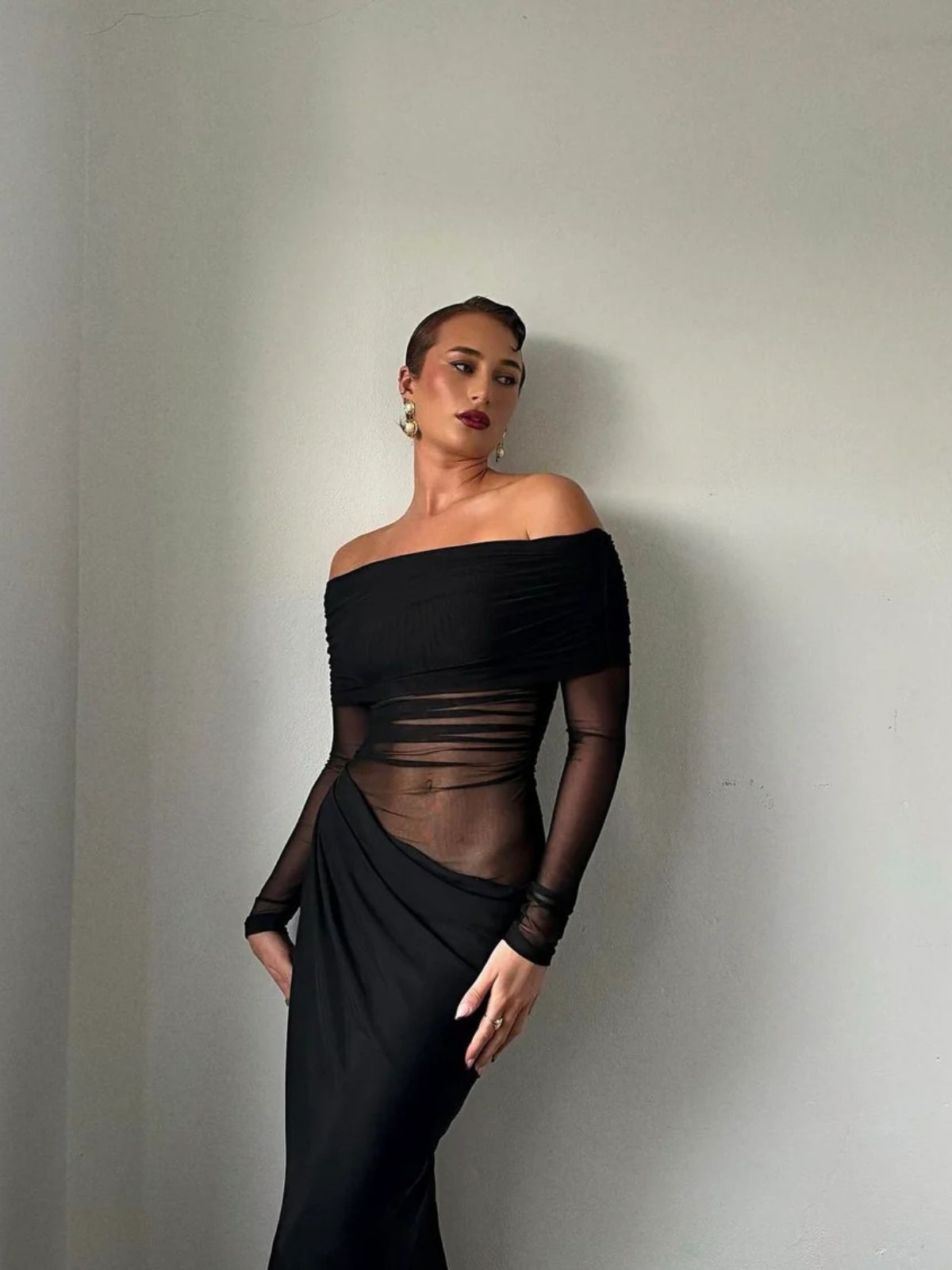 Black Orchid Off-Shoulder Dress, elegant long-sleeve design, perfect for a sophisticated evening look.
