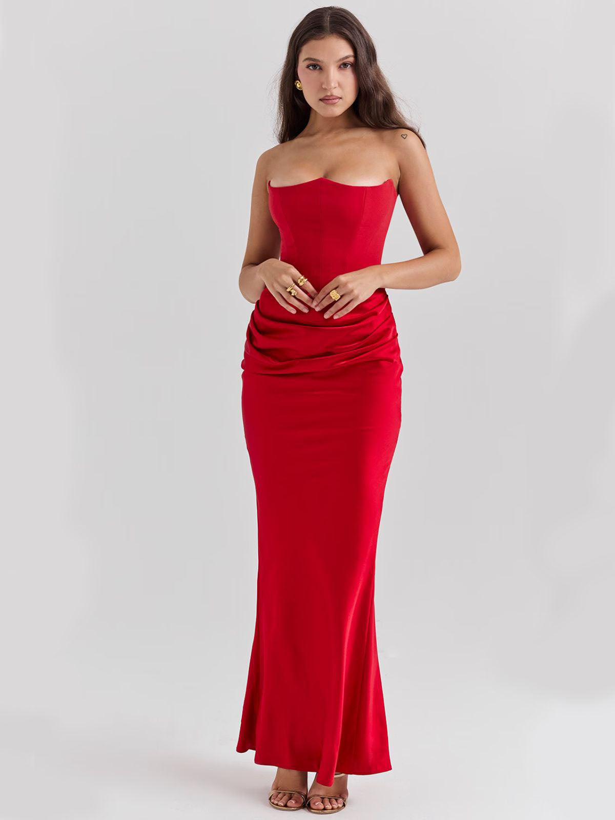 Celestine Corset Maxi Dress - Red, angled pose capturing the luxurious satin draping and strapless corset fit.