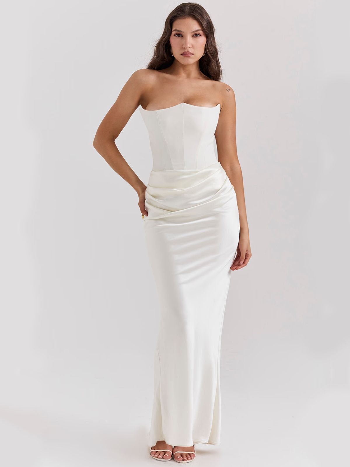 Celestine Corset Maxi Dress - White, angled pose capturing the luxurious corset fit and elegant satin draping.