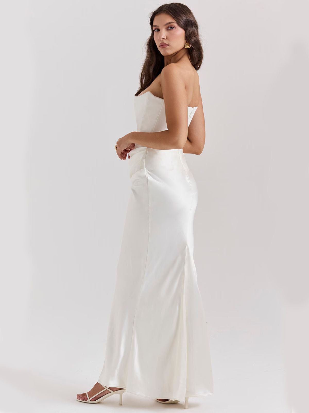 Celestine Corset Maxi Dress - White, side angle displaying the smooth satin finish and flattering draped detail.