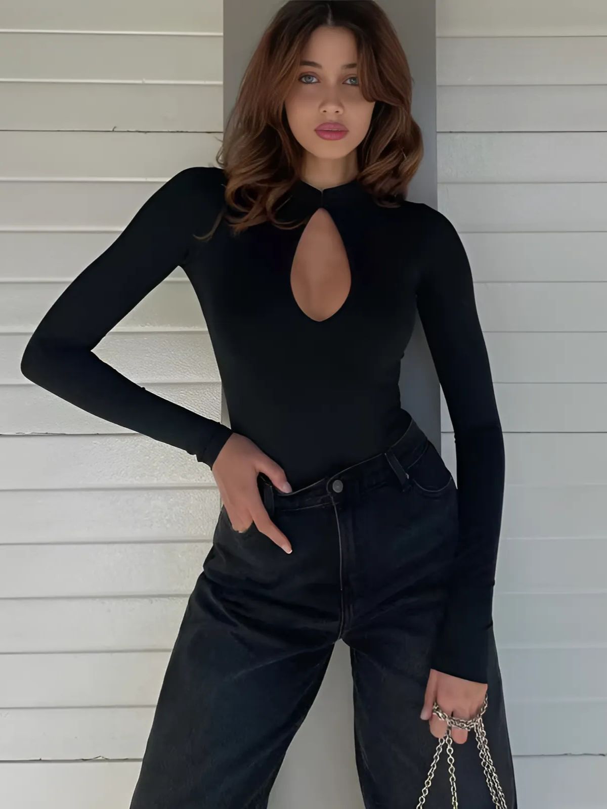 Eclipse Black High Neck Bodysuit front view showcasing elegant fit and keyhole neckline detail for a chic style.