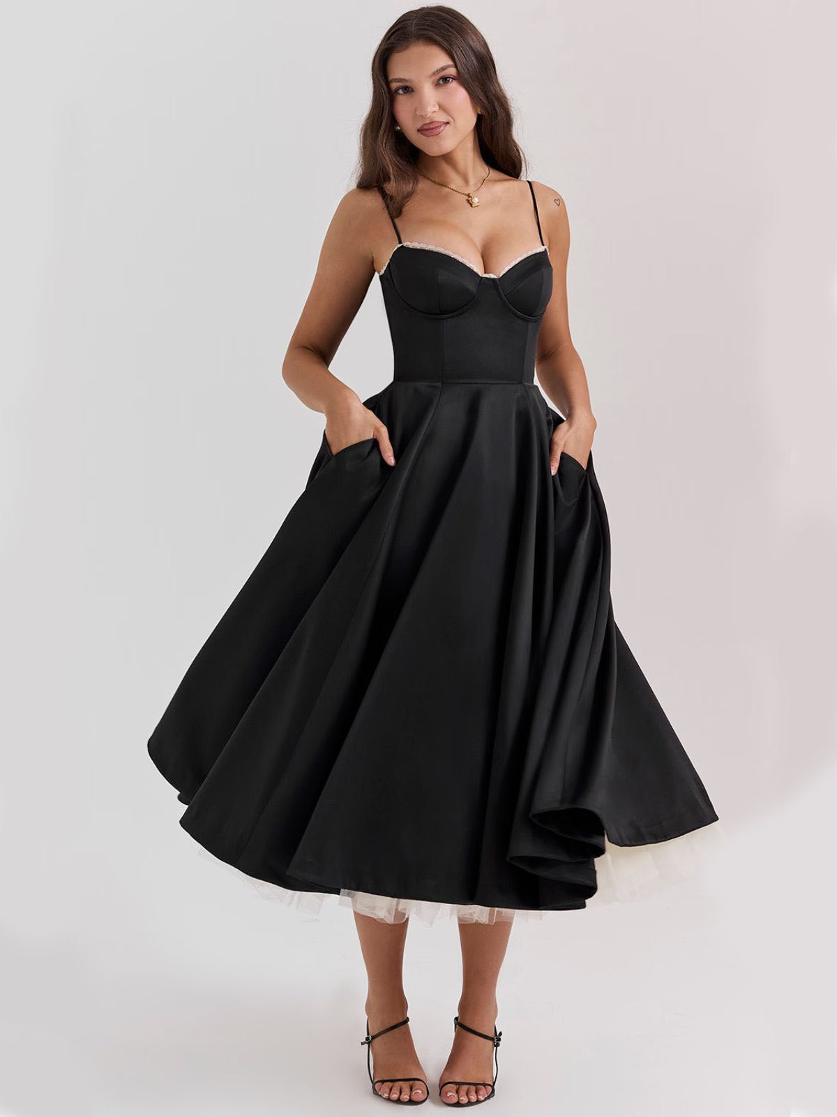 Eclipse Corset Gown – A stunning black corset dress perfect for evening wear, featuring a structured bustier and flowing silhouette.