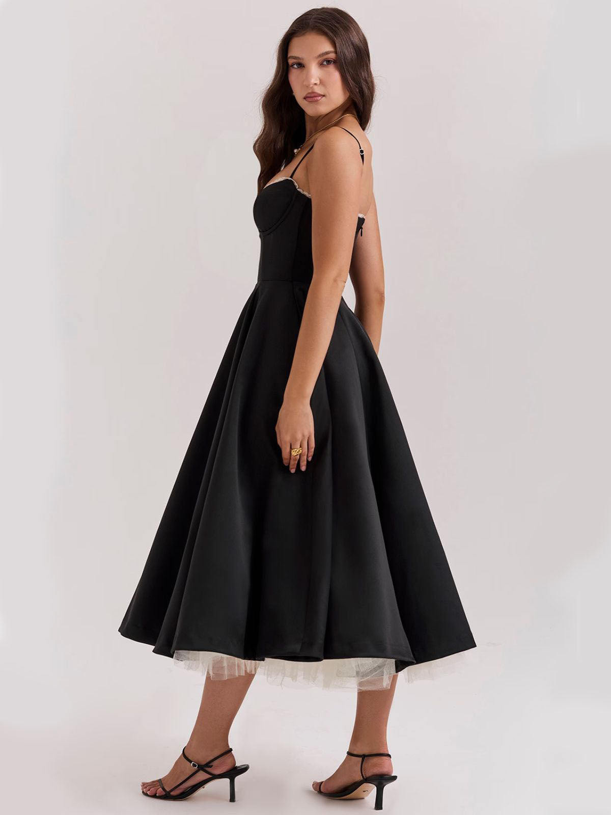 Eclipse Corset Gown – A glamorous black corset dress with adjustable straps, a defined waist, and a full flared skirt for elegance.