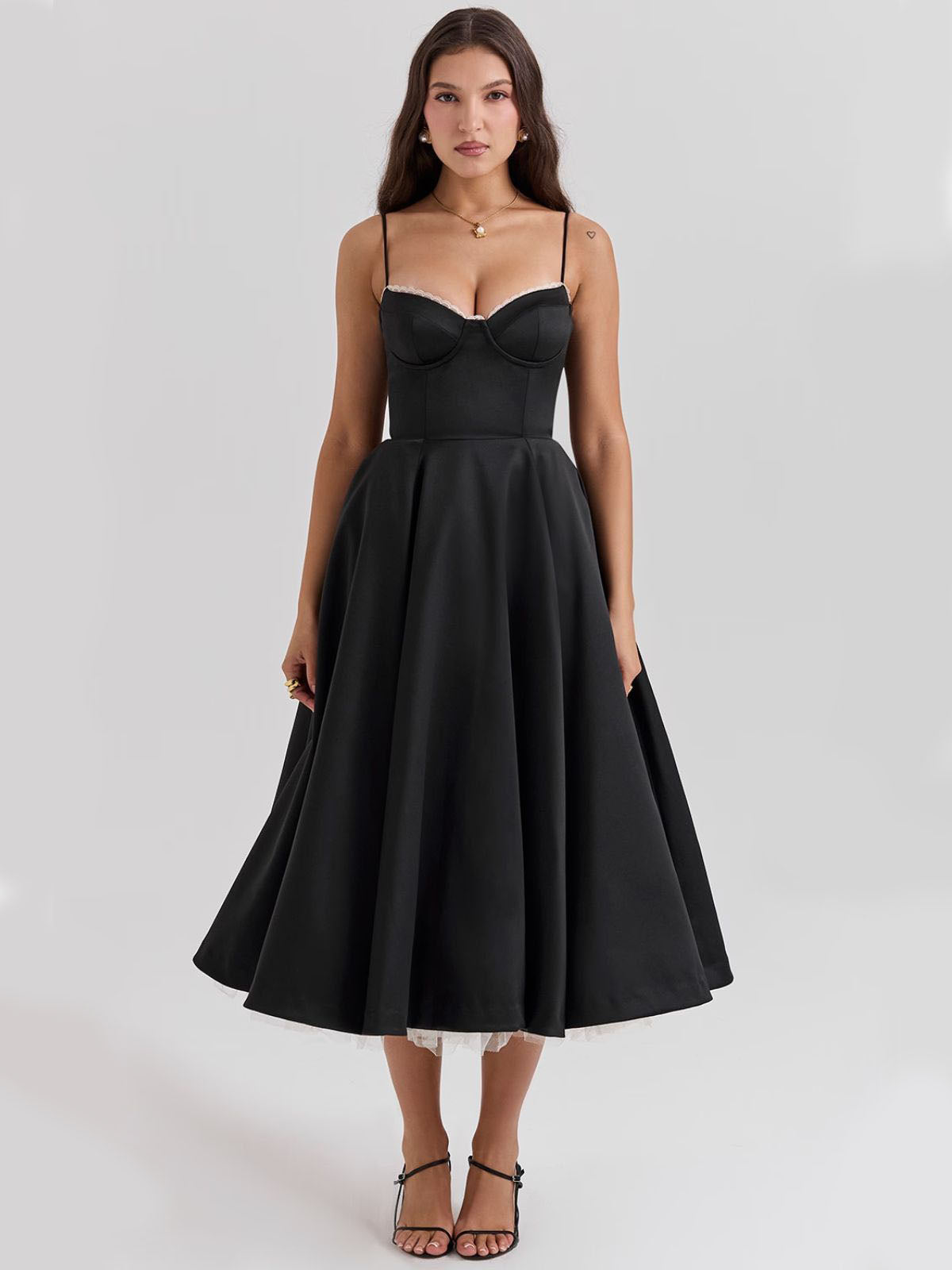 Eclipse Corset Gown – A retro-style black corset dress with a fitted bodice, full-circle skirt, and delicate tulle underlay.