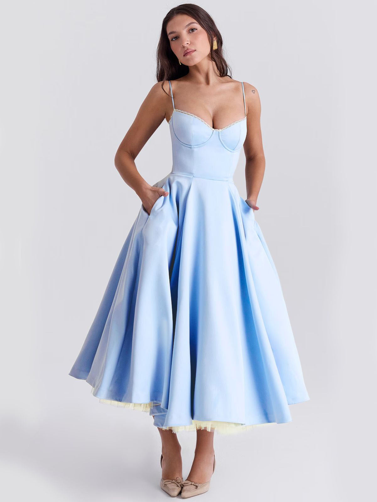 Eclipse Corset Gown – A luxurious blue midi dress designed for evening wear, with a structured bustier and flowing skirt.
