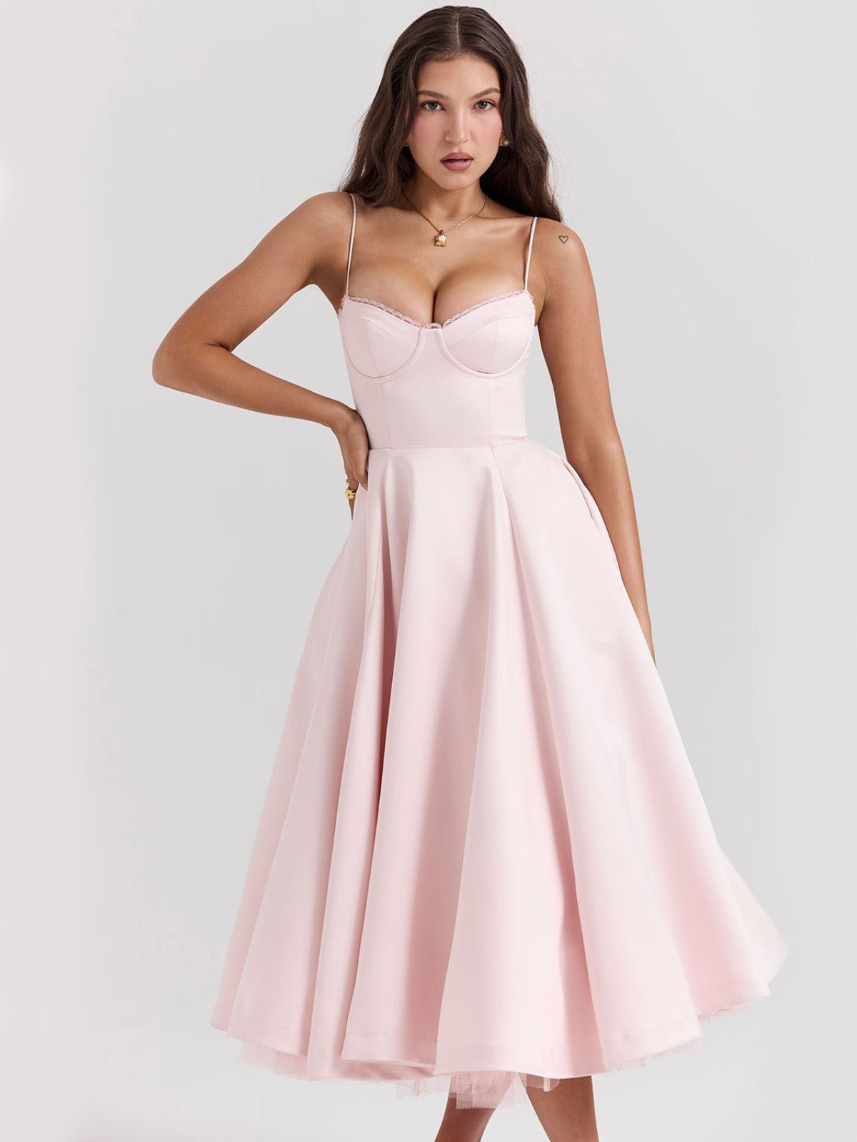 Eclipse Corset Gown – A soft pink corset dress perfect for evening wear, designed with a cinched waist and graceful midi-length skirt.