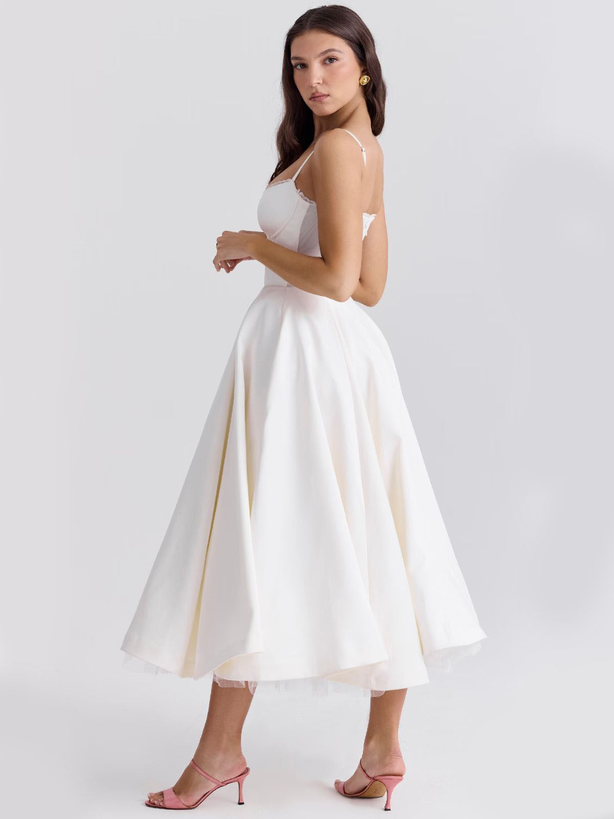 Eclipse Corset Gown – A chic white midi dress with adjustable straps, a structured corset bodice, and a graceful flared hemline.