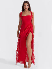 Elysian Ruffle Maxi - Red front view, featuring elegant ruffles, a square neckline, and a high slit for a bold look.