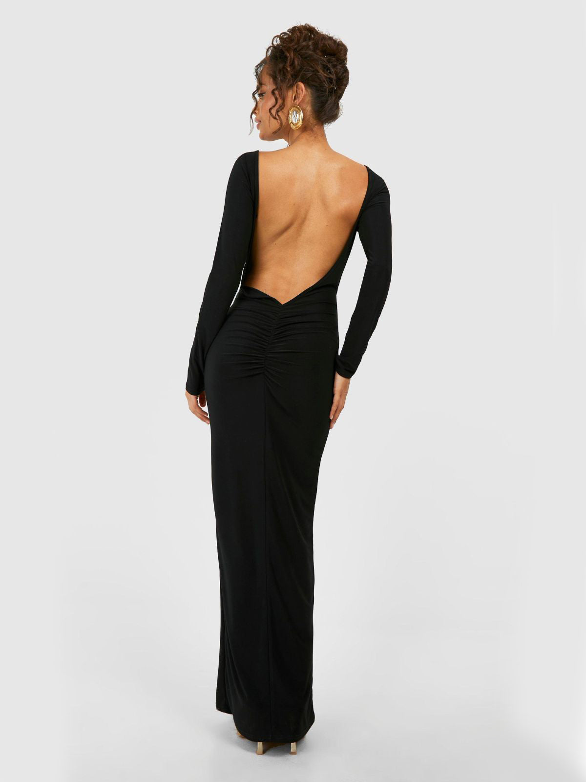Evelina Backless Maxi Dress in black, side view showcasing the stunning silhouette for evening wear.
