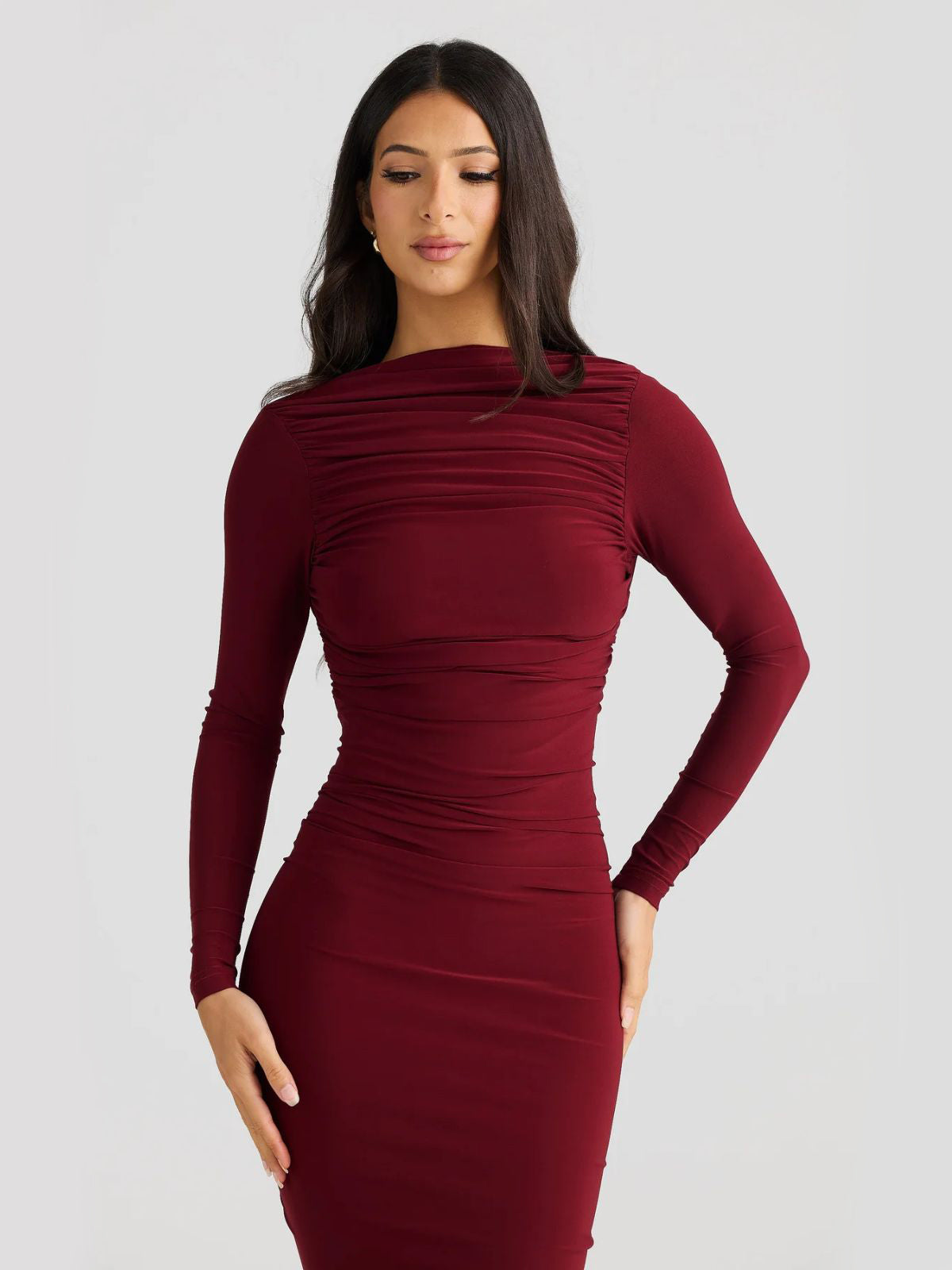 Evelina Backless Maxi Dress in red, a glamorous prom dress with long sleeves and a backless design.