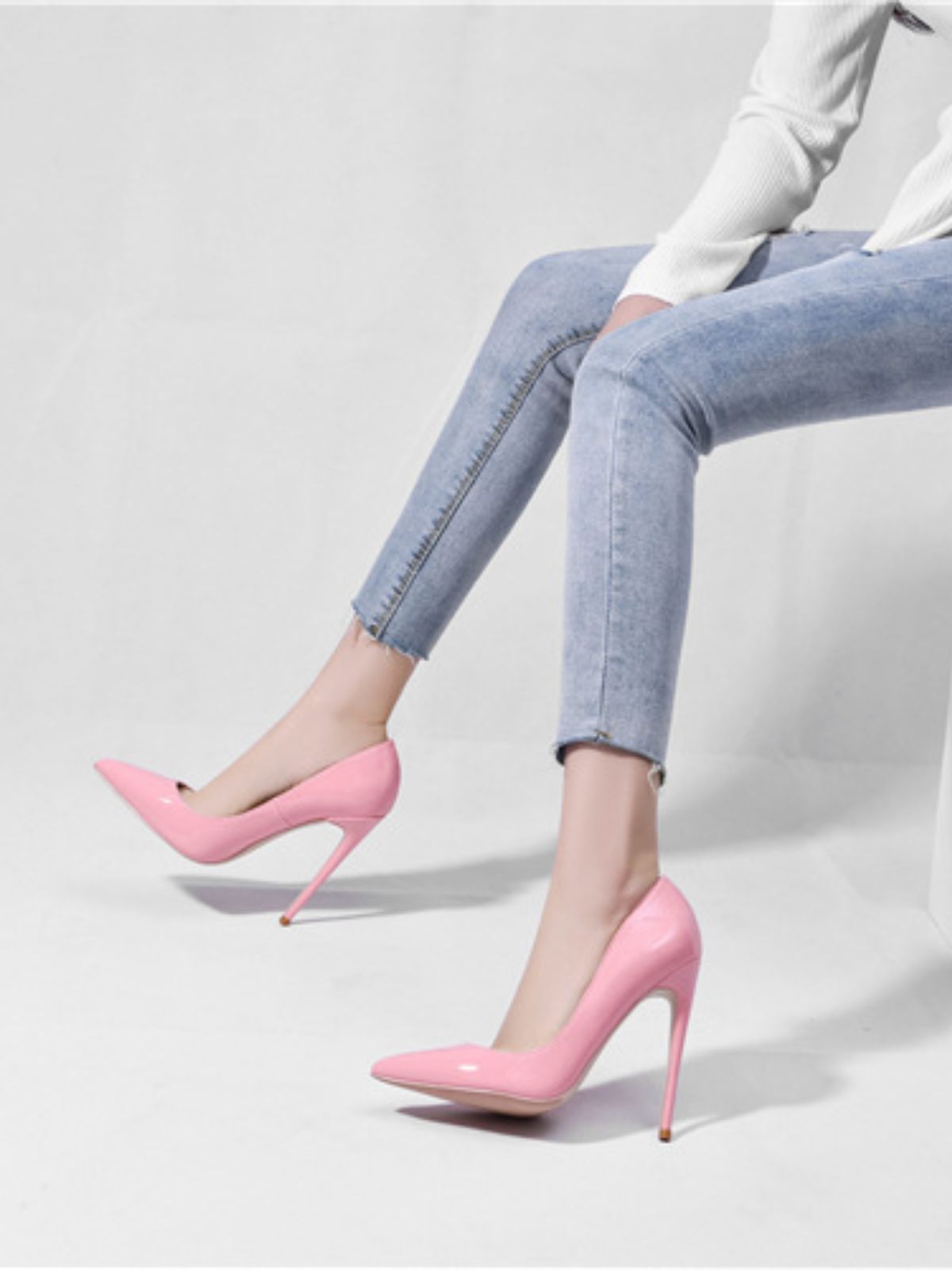 Glamour Stilettos Heels – Wide Fit soft pink patent stilettos paired with cropped jeans on model