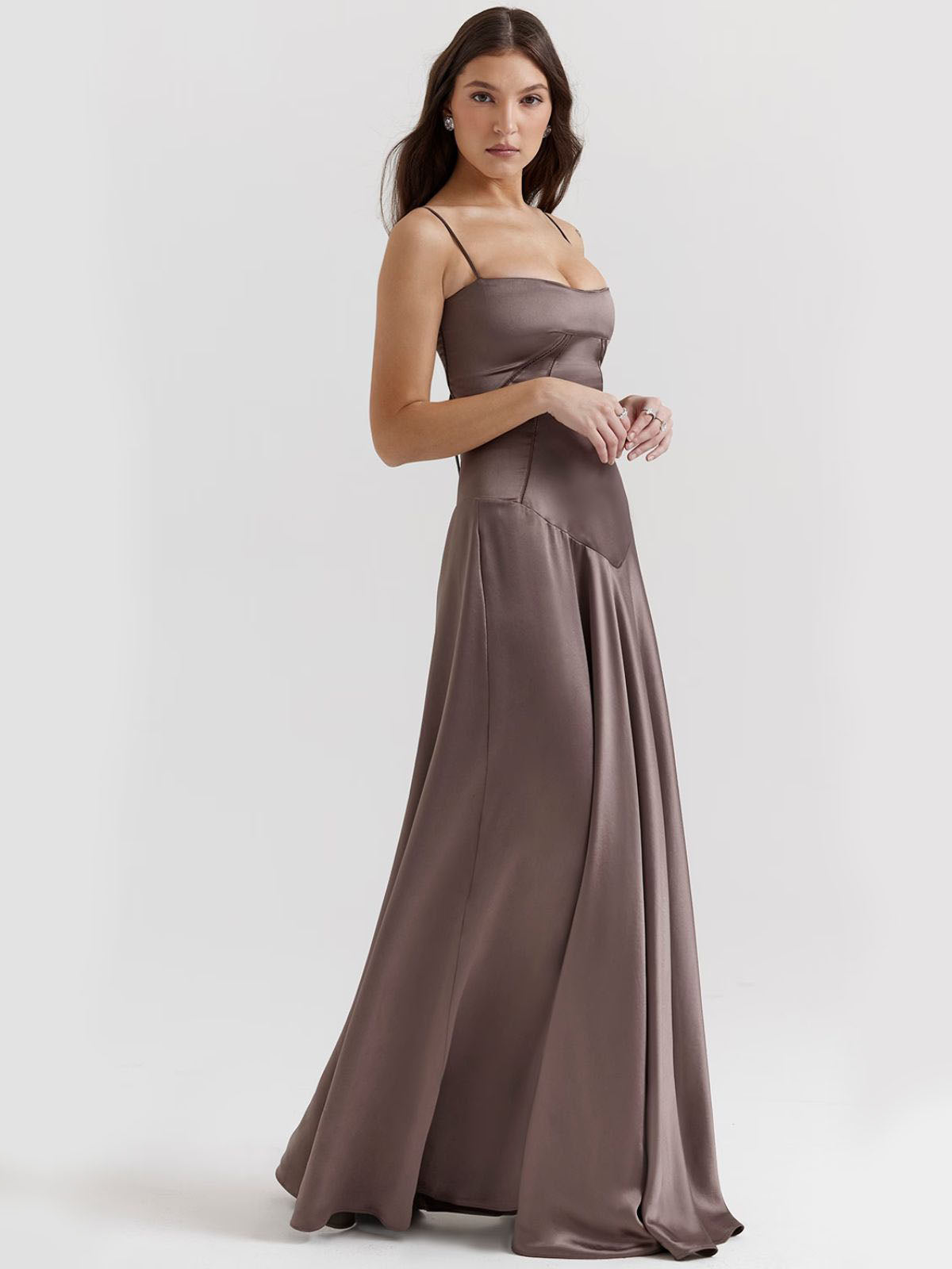 Gray backless dress with a sleek satin finish, fitted bodice, and maxi-length skirt for an elegant evening look.