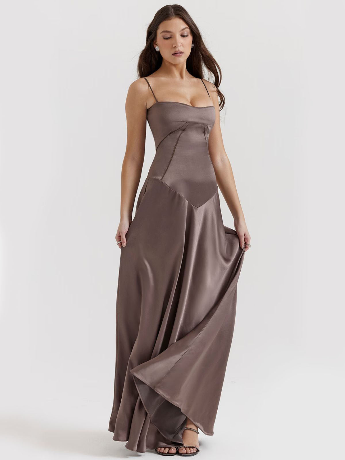 Gray backless dress crafted from silky satin with a flowing skirt and structured bodice, ideal for elegant occasions.