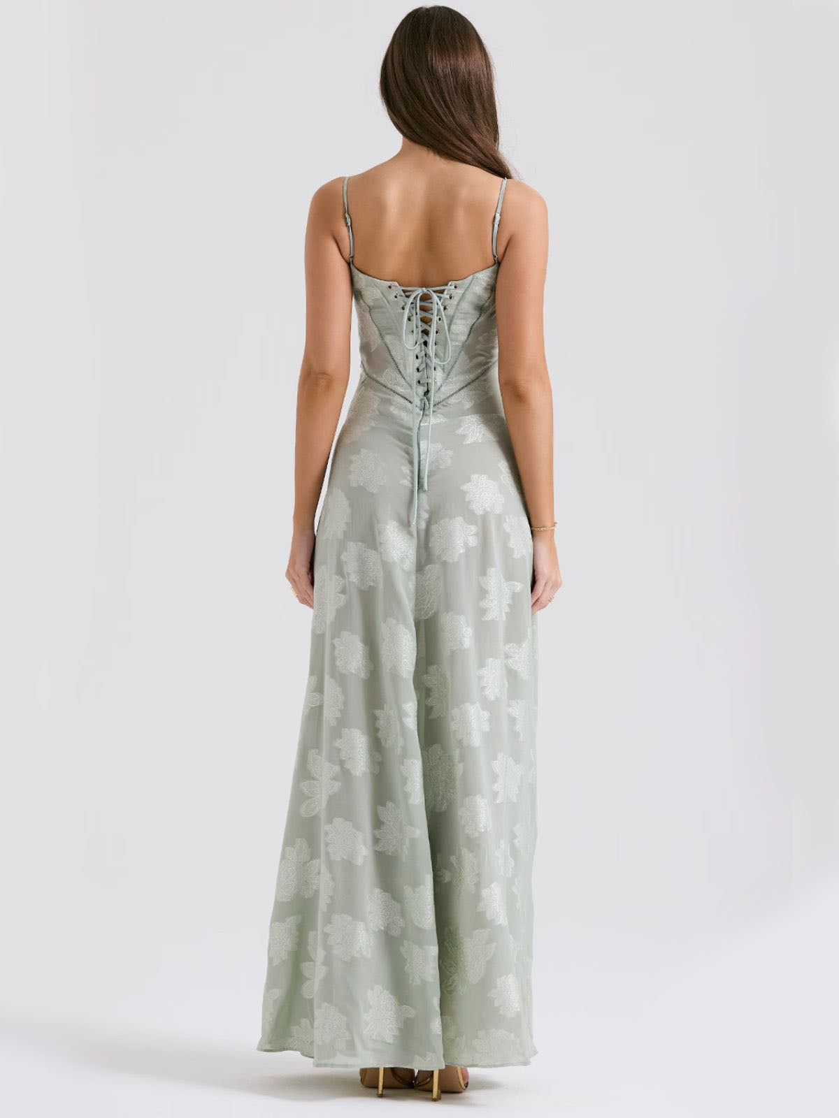 Green floral maxi dress with an intricate lace-up back, perfect for a dreamy and romantic aesthetic.