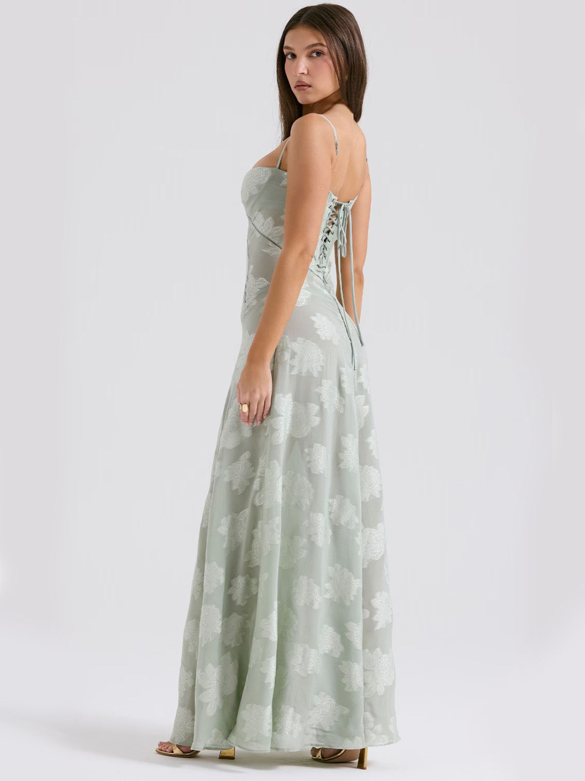 Green floral maxi dress with lace-up back, delicate embroidery, and adjustable fit—perfect for elegant occasions.