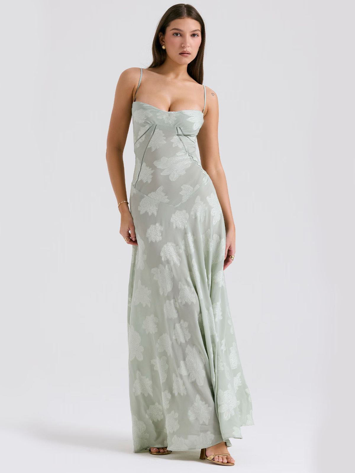 Green floral maxi dress with a stunning side view, showing the flowy fabric, adjustable straps, and lace-up corset back.