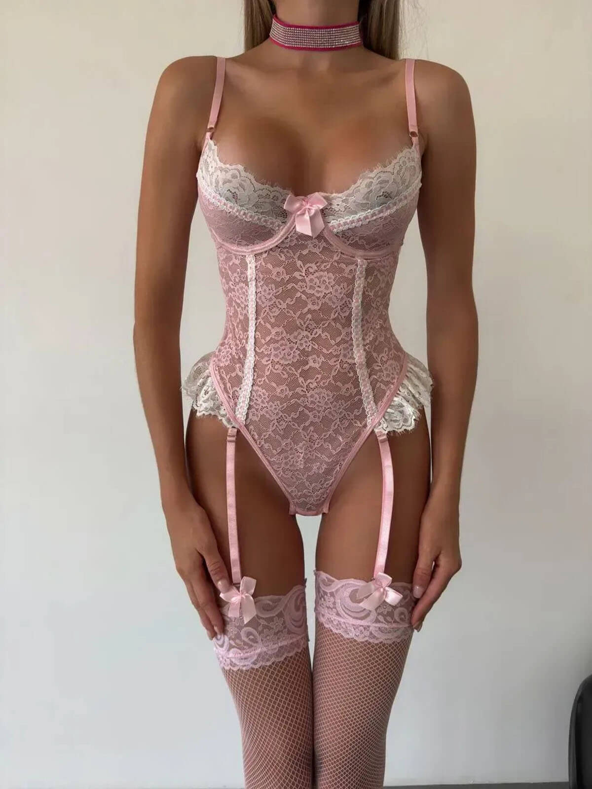 lace teddy bodysuit front detail with thong cut, pink lace panels and fishnet stockings