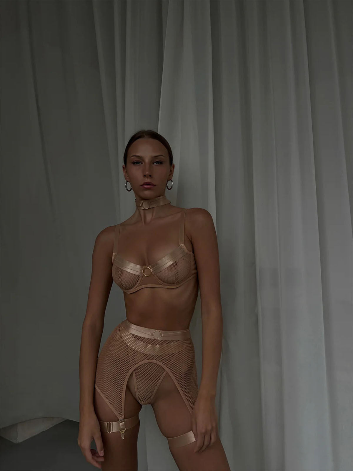 Lingerie Nude Halo Set in beige tone, styled with mesh texture and gold metal ring accents.