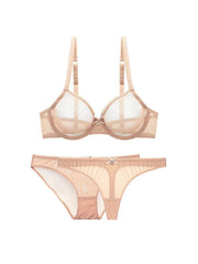 nude three-piece lingerie set with sheer fabric and fine lace, flatlay display.