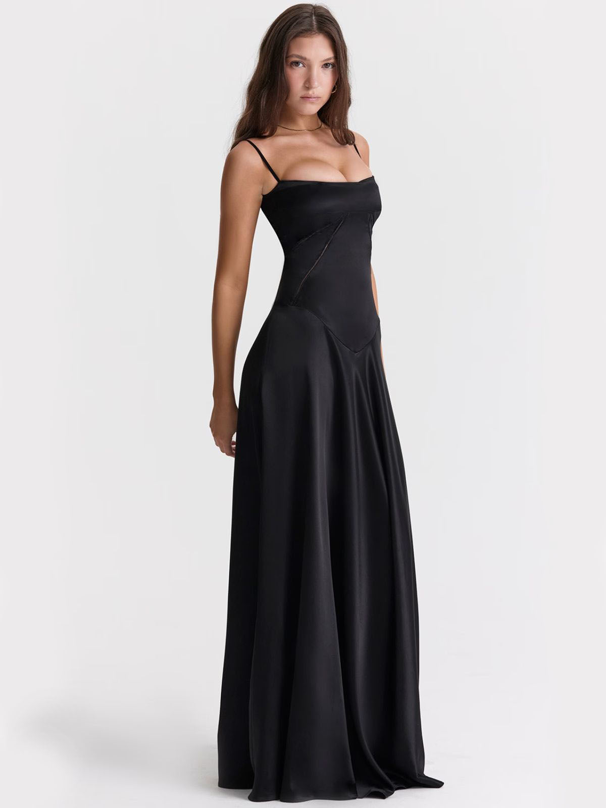 Ophelia black backless dress with delicate spaghetti straps, a structured bodice, and a luxurious flowing skirt.