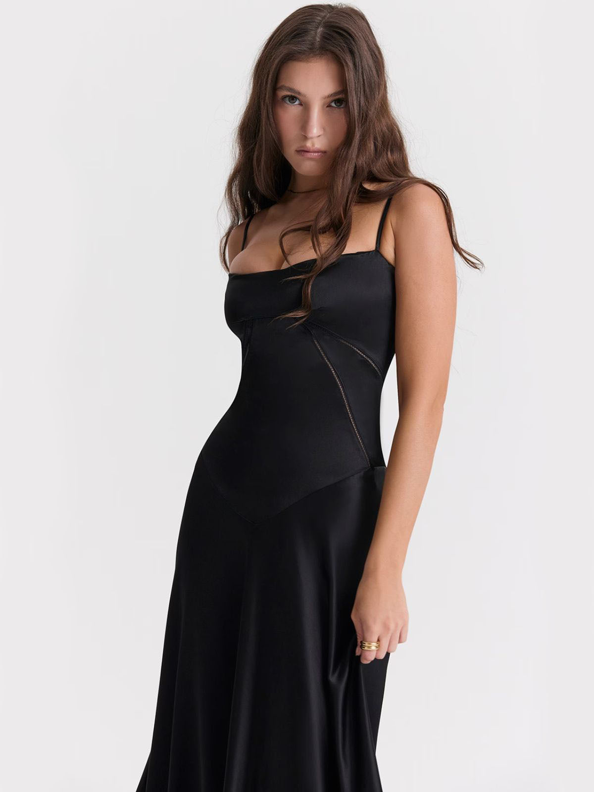 Ophelia black backless dress with a satin maxi-length skirt, offering an effortlessly chic and formal evening look.