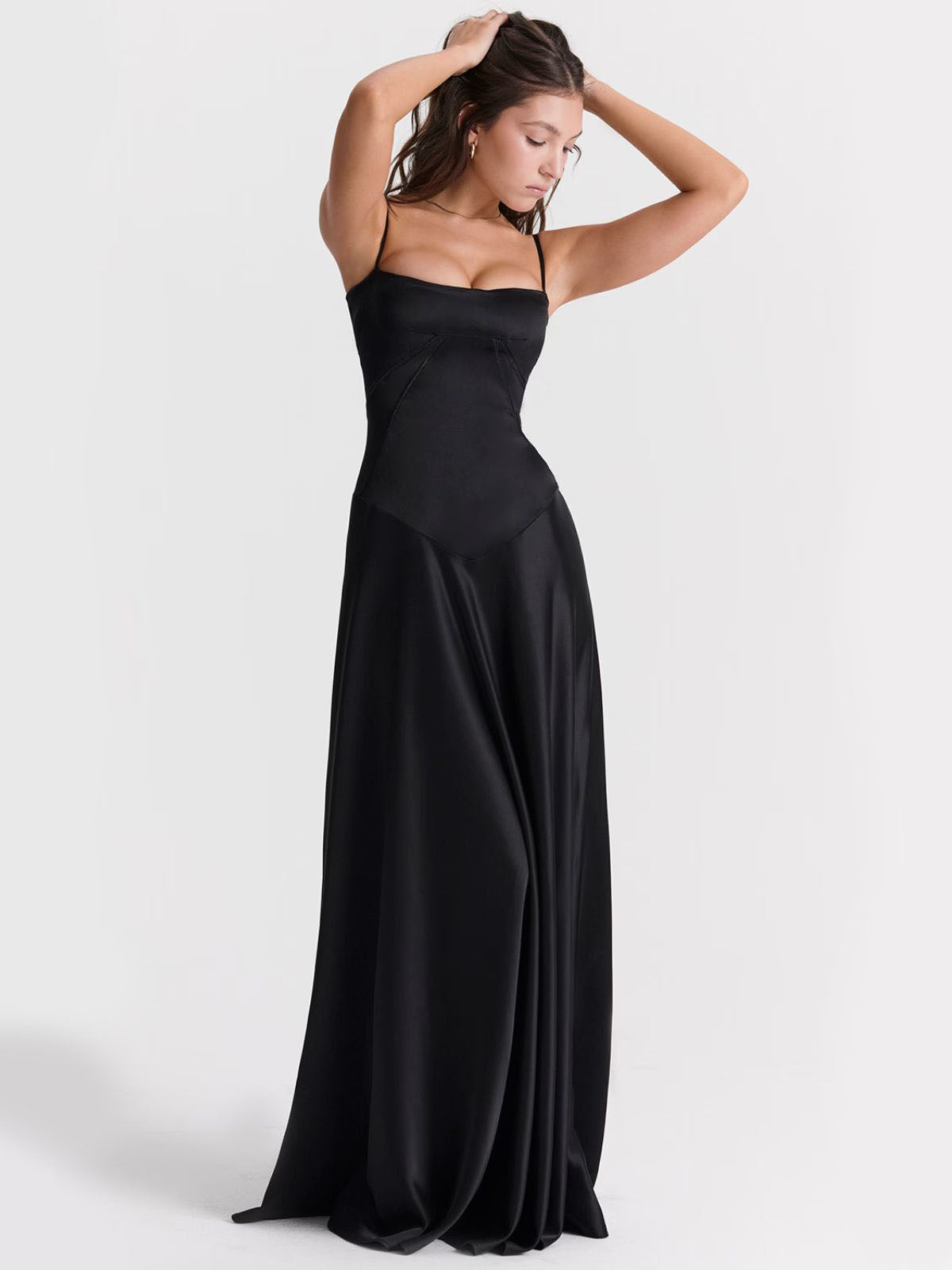 Ophelia black backless dress with a corset-inspired fit, showing the silhouette and satin fabric's elegant drape.