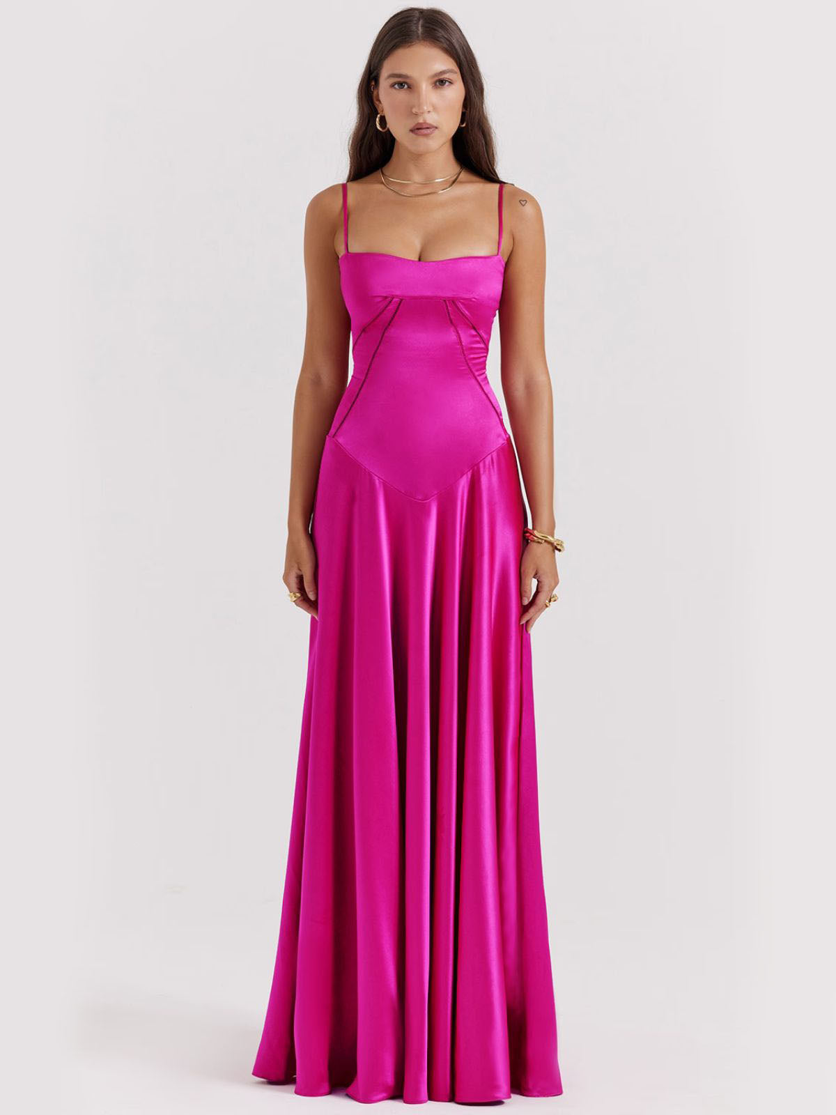Pink backless dress with a sleek satin finish, fitted bodice, and maxi-length skirt for an elegant evening look.