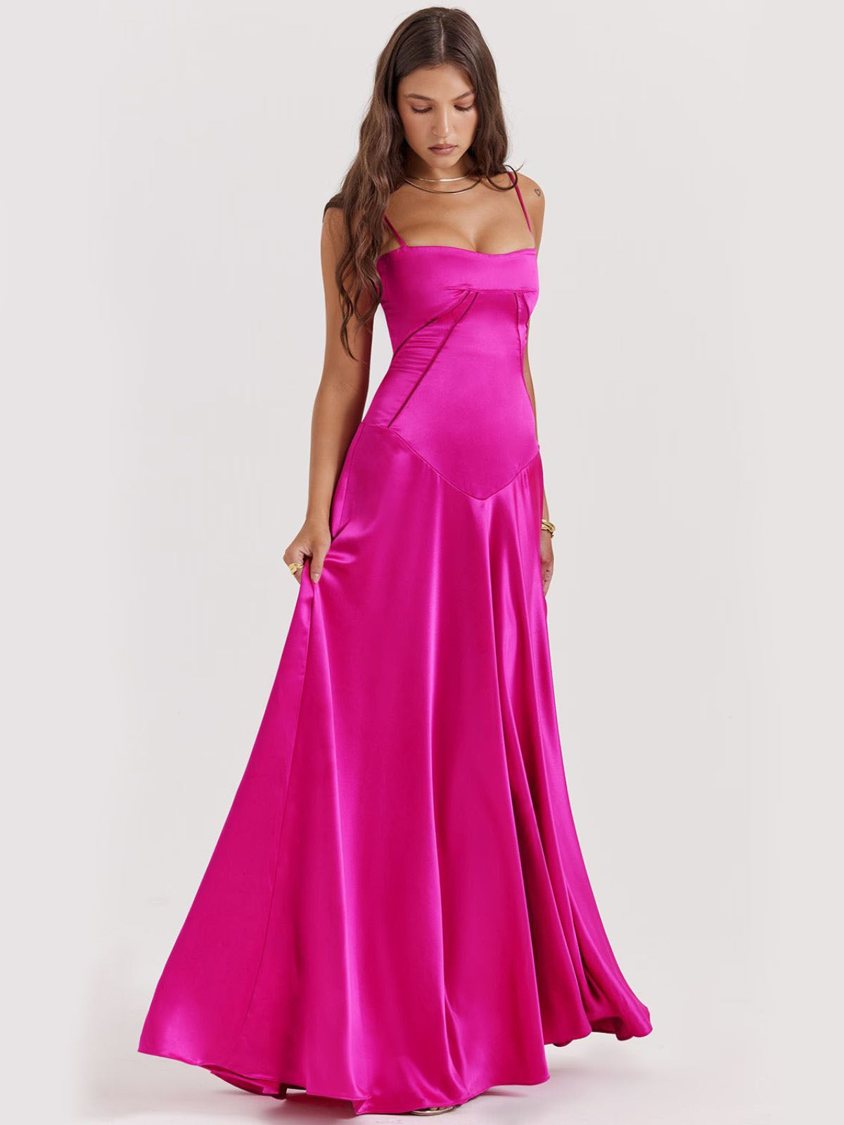 Pink backless dress featuring a flattering corset-inspired fit, draped satin fabric, and an effortless maxi-length skirt.