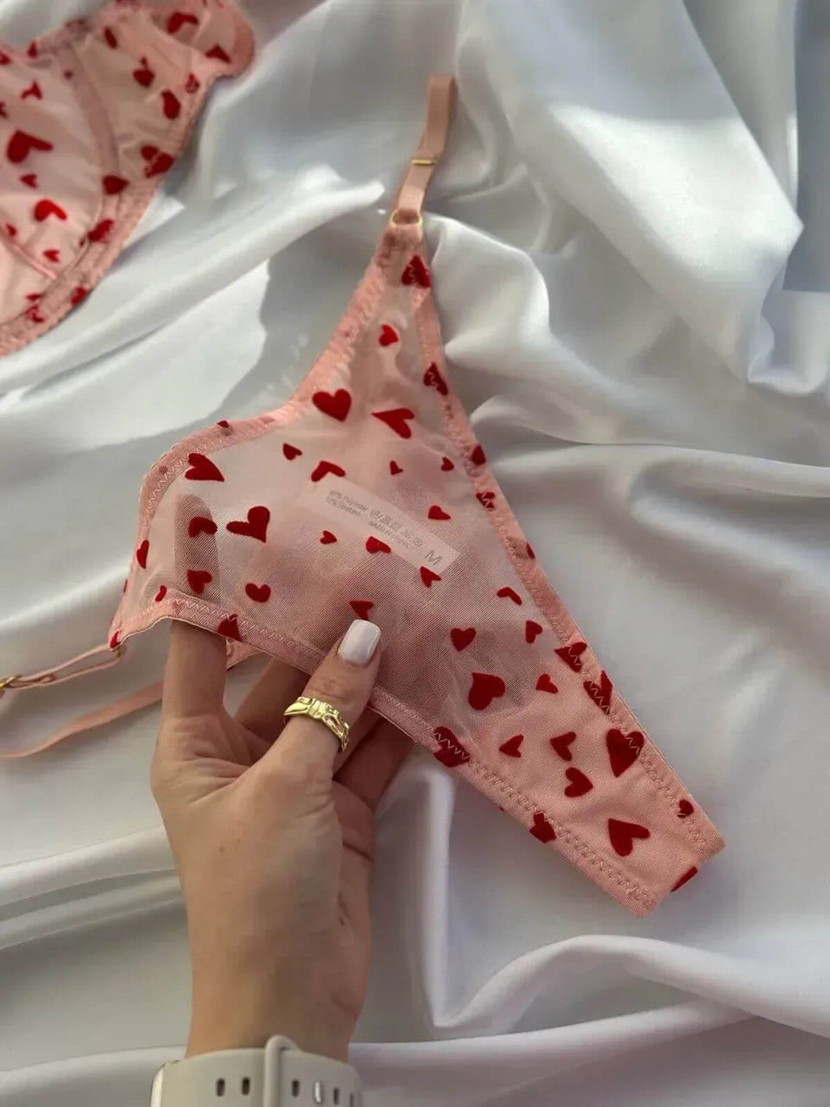 Pink Heart Lingerie thong close-up with sheer mesh fabric and red heart print