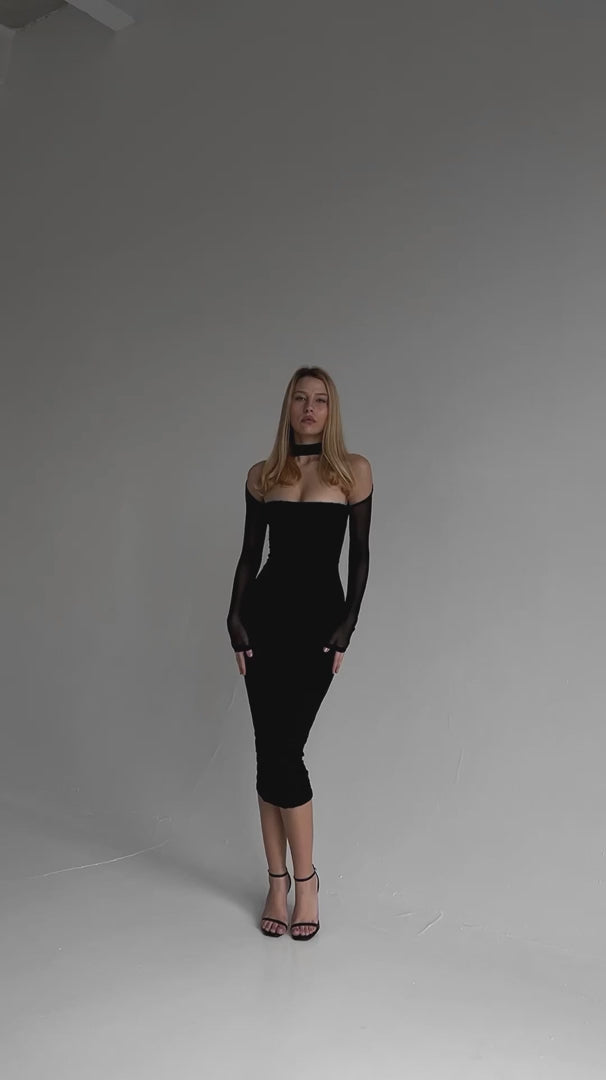 Load video: Selene Party Elegance black corset dress video showcasing its backless design, mesh sleeves, and fitted silhouette for evening glamour.