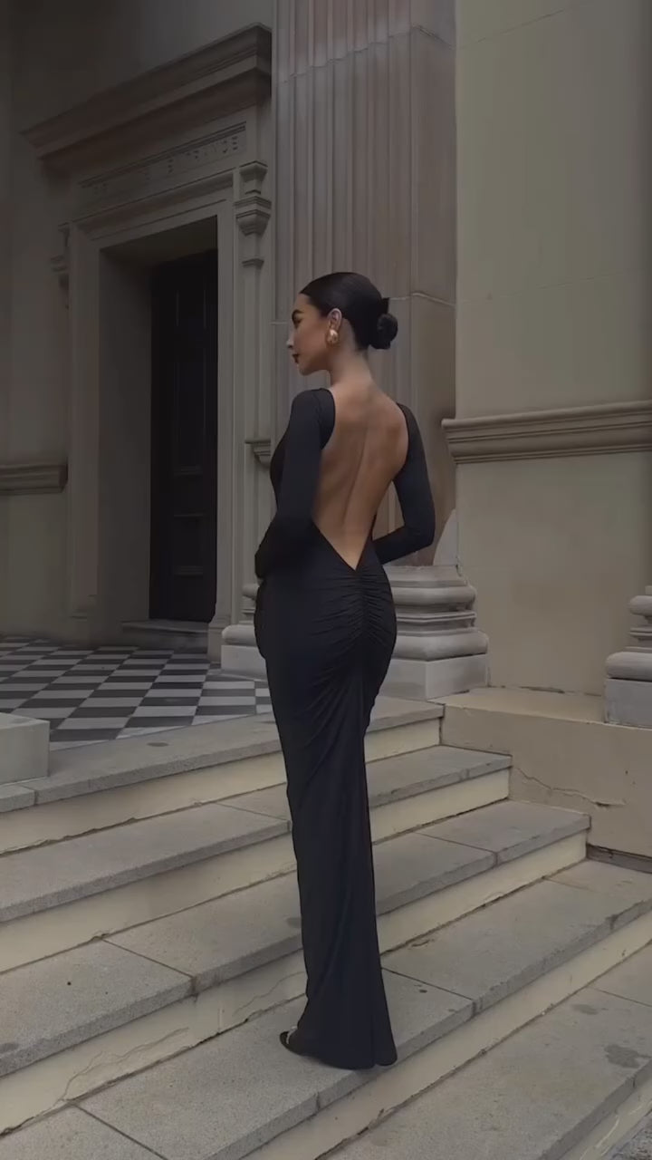 Load video: Evelina Backless Maxi Dress in red and black, showcasing the elegant design, backless cut, and perfect fit for prom or evening wear.