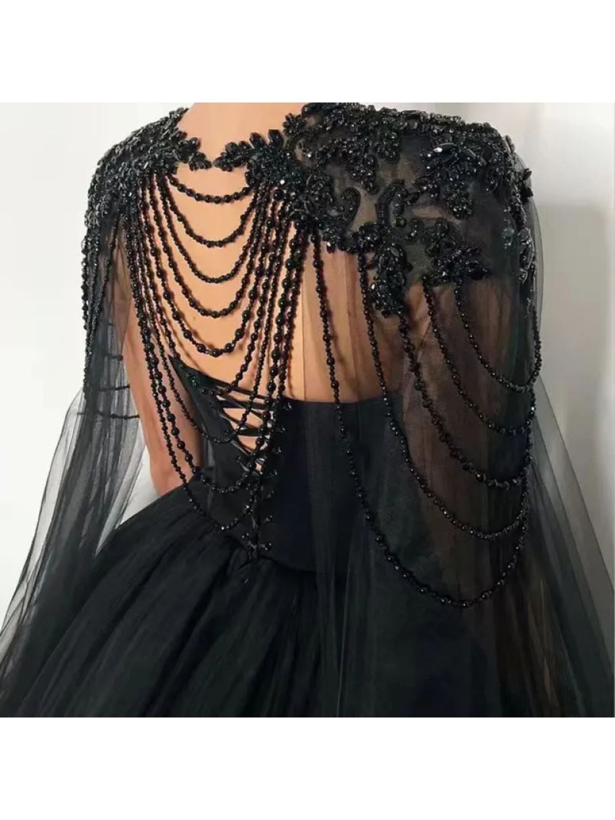 Raven Noir Embellished Wedding Gown back details with cascading beaded chains and corset lace-up design.
