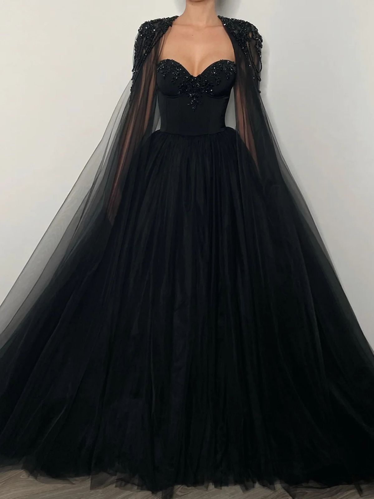 Raven Noir Embellished Wedding Gown full front view showcasing its dramatic tulle skirt and detailed embellishments.