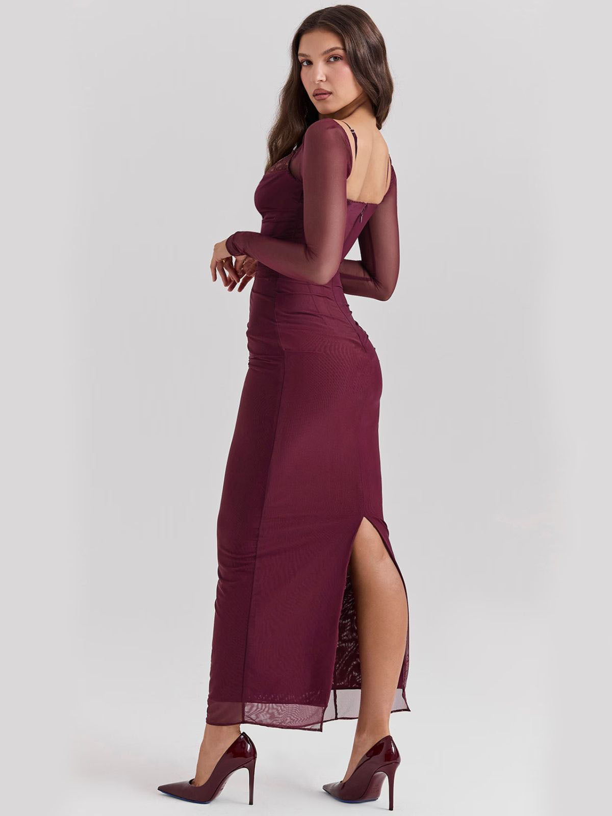 Sable Lace Wine Maxi Dress side view with sheer long sleeves and back slit, a chic and elegant choice for evening wear.