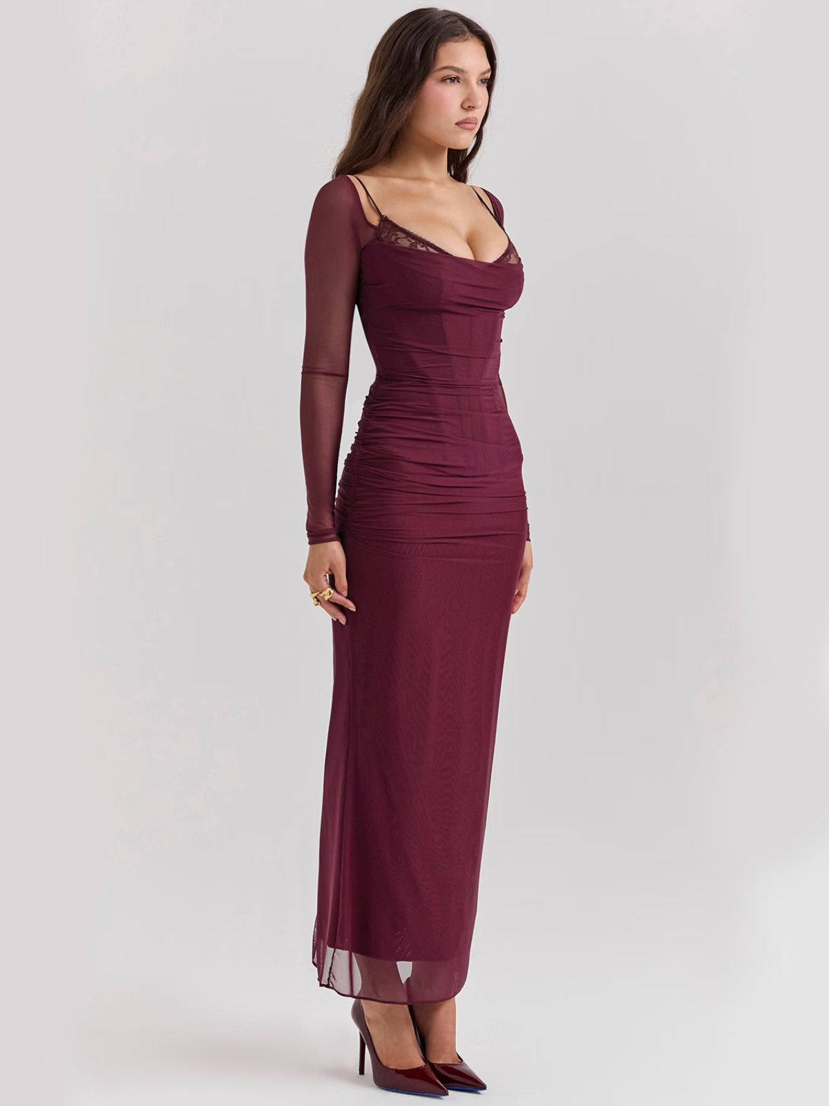 Sable Lace Wine Maxi Dress with lace details, sheer sleeves, and a sleek fit, an essential for an effortlessly glamorous look.