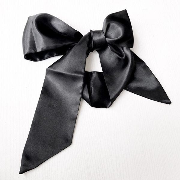 Satin Bow Bedroom Cuffs styled as elegant black hair ribbon accessory