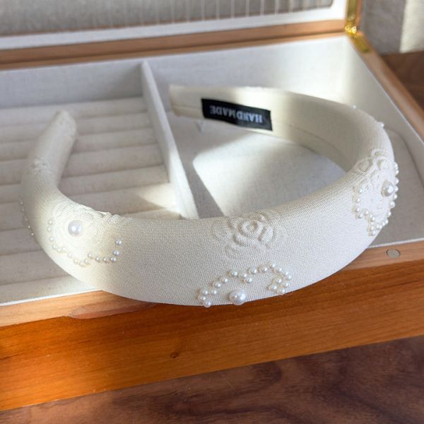Satin Pearl Accent Headband featuring elegant detailing and soft pastel tones – perfect for stylish everyday or bridal wear